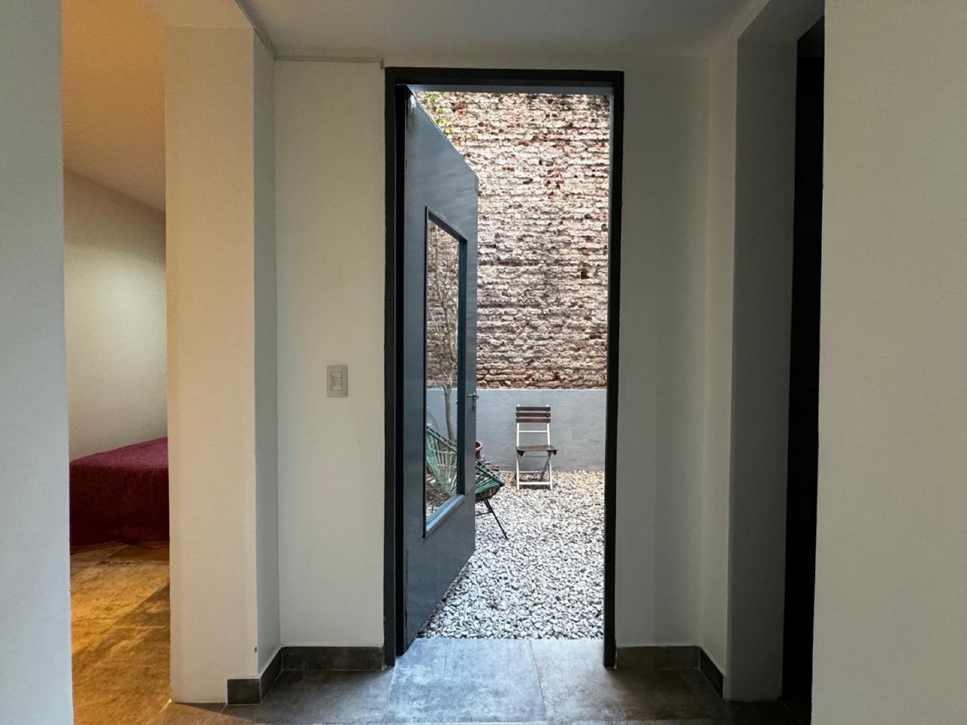 The flat with the patio — From the patio into the bedroom